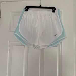 White and blue Nike running shorts